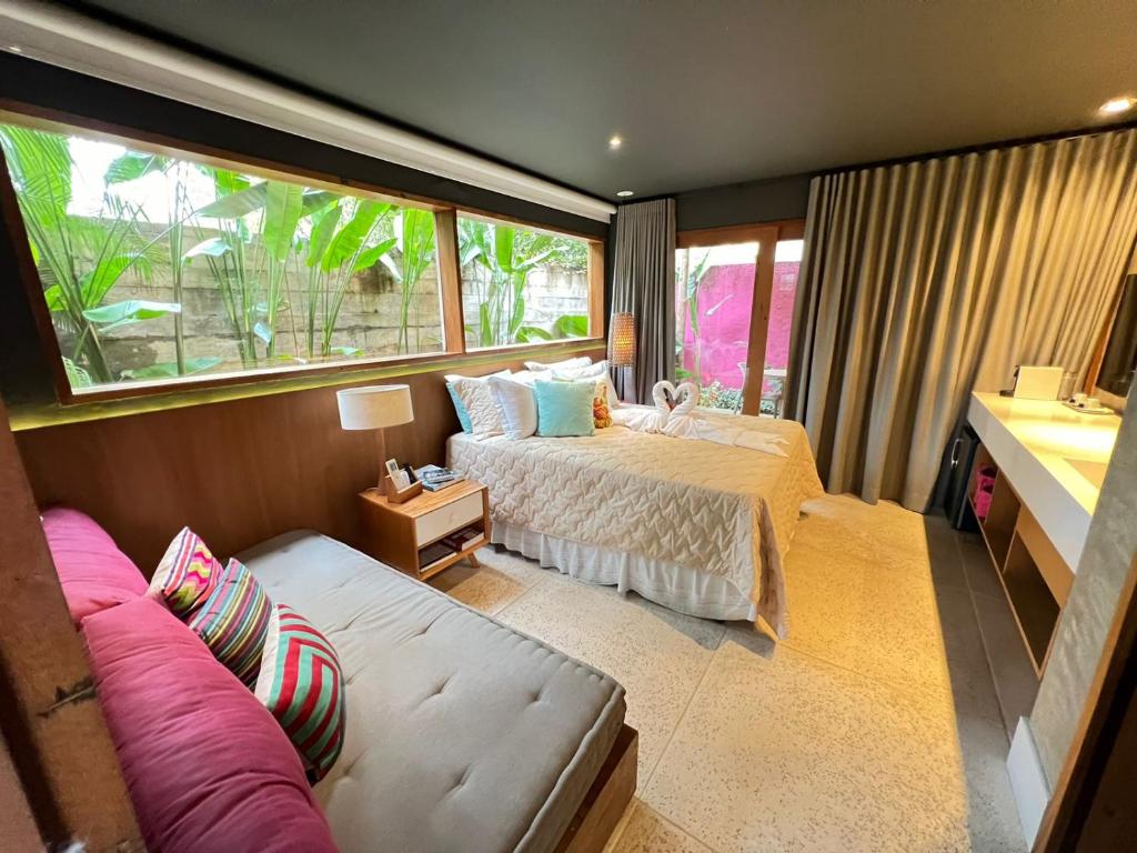 Cama ou camas em um quarto em Pousada Refúgio de Maresias