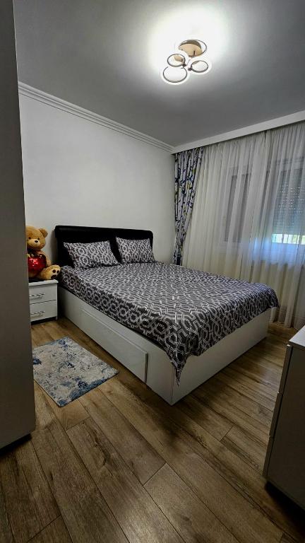a bedroom with a bed in a room at Cozy residence in Buzău