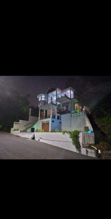a large house on the side of a road at La Bwizan Apt #3 in Laborie
