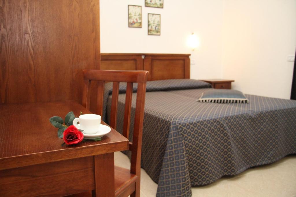 Postel nebo postele na pokoji v ubytování Residence I Due Pini