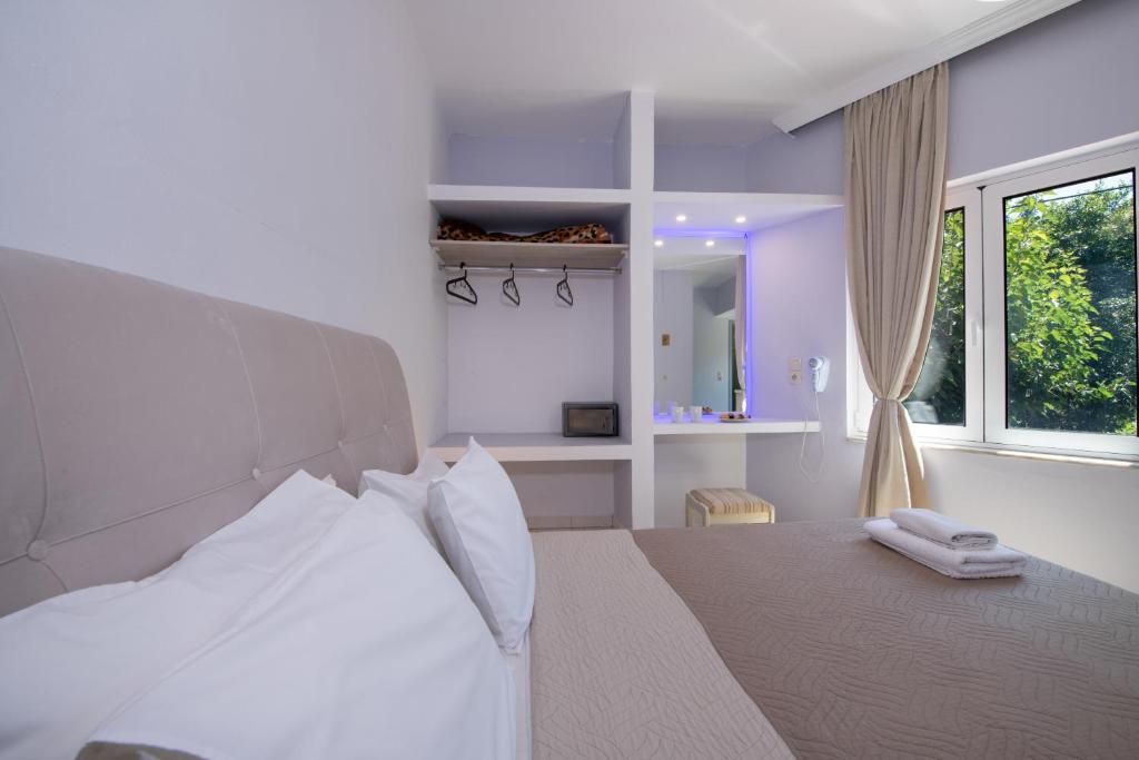 Posteľ alebo postele v izbe v ubytovaní Labyrinth Hotel