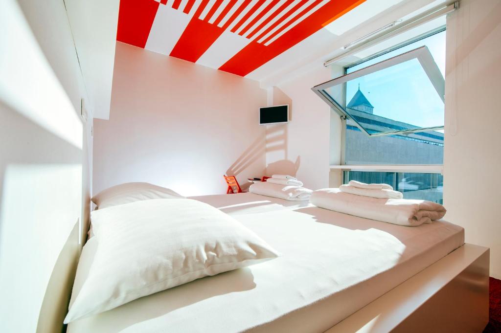 Postel nebo postele na pokoji v ubytování Boutique Hostel Forum