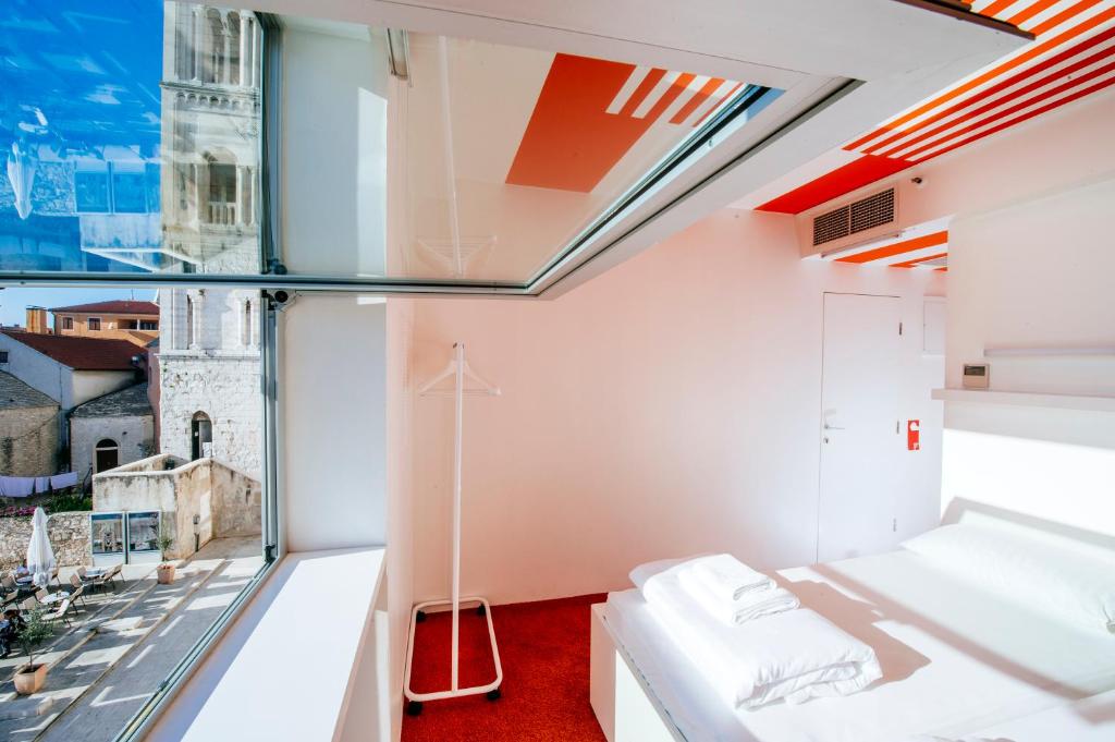 Postel nebo postele na pokoji v ubytování Boutique Hostel Forum