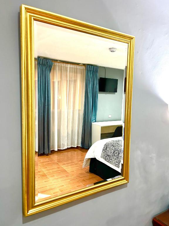 Postel nebo postele na pokoji v ubytování ACCEL Hotel La Quinta