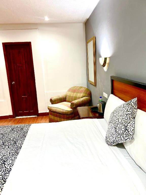 Postel nebo postele na pokoji v ubytování ACCEL Hotel La Quinta