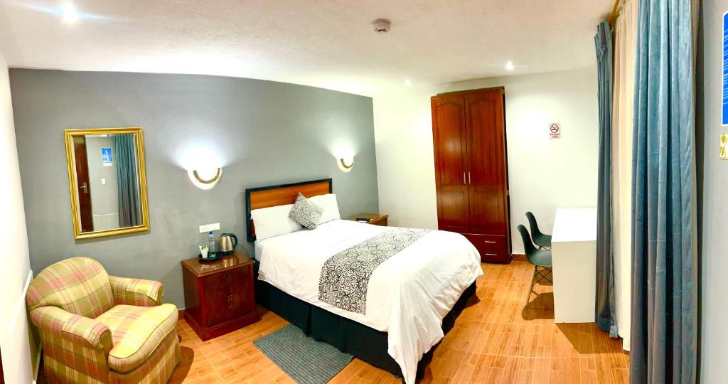 Postel nebo postele na pokoji v ubytování ACCEL Hotel La Quinta