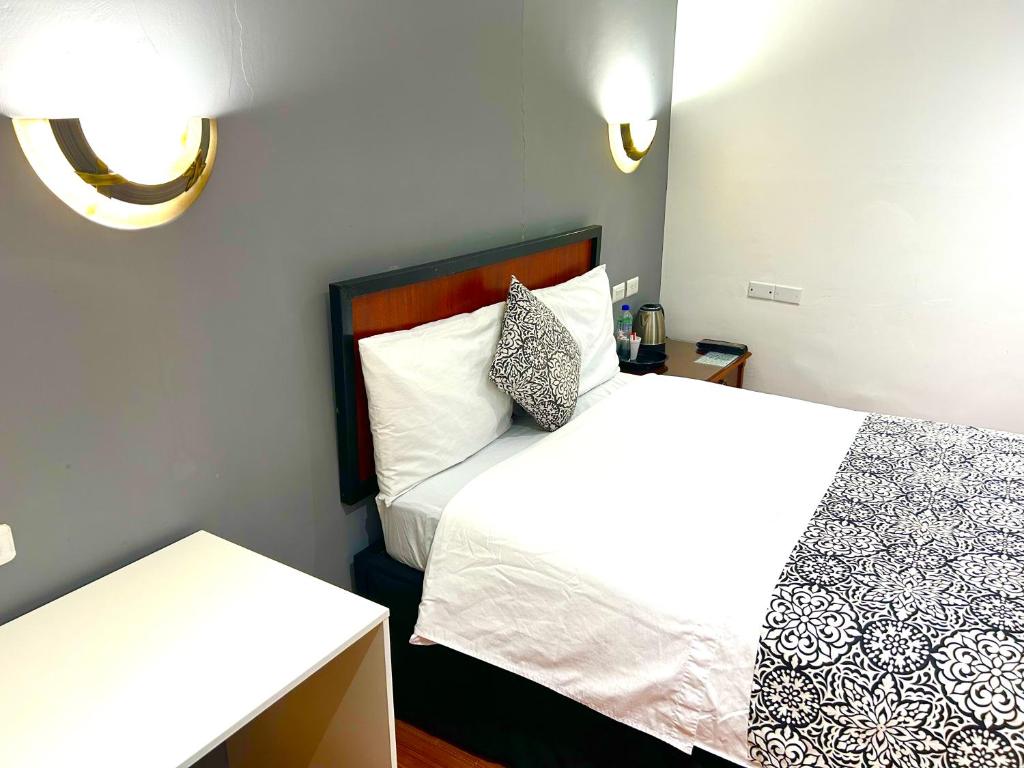 Postel nebo postele na pokoji v ubytování ACCEL Hotel La Quinta