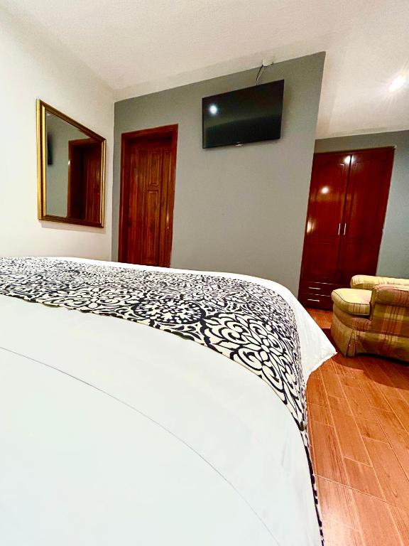 Postel nebo postele na pokoji v ubytování ACCEL Hotel La Quinta