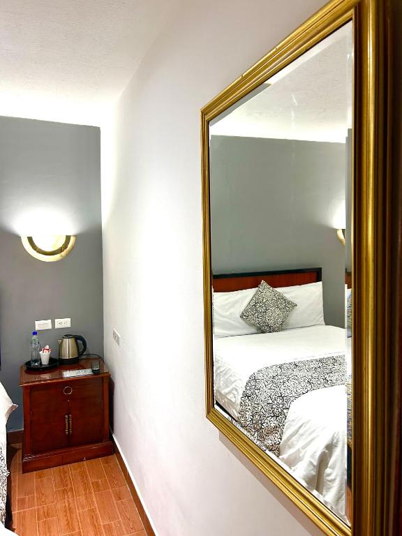Postel nebo postele na pokoji v ubytování ACCEL Hotel La Quinta