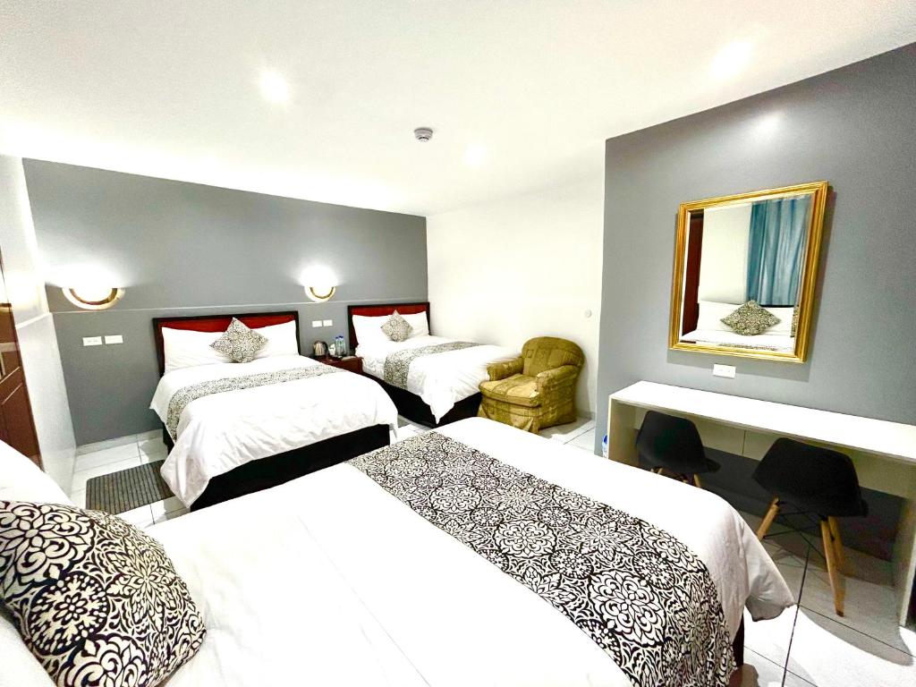 Postel nebo postele na pokoji v ubytování ACCEL Hotel La Quinta