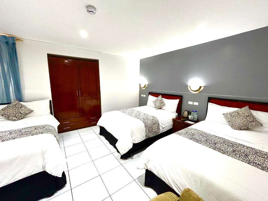 Postel nebo postele na pokoji v ubytování ACCEL Hotel La Quinta