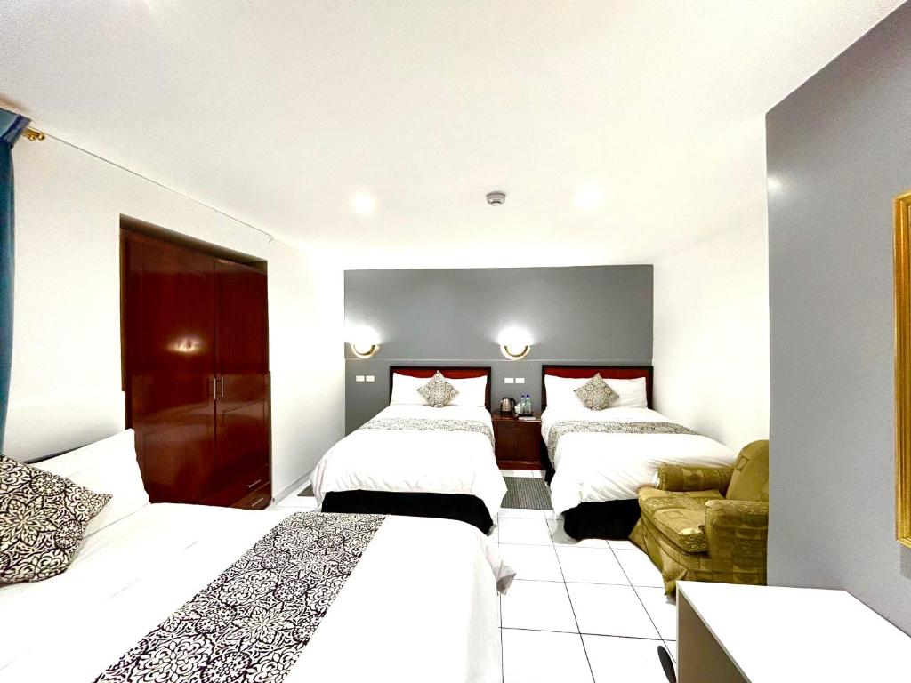 Postel nebo postele na pokoji v ubytování ACCEL Hotel La Quinta