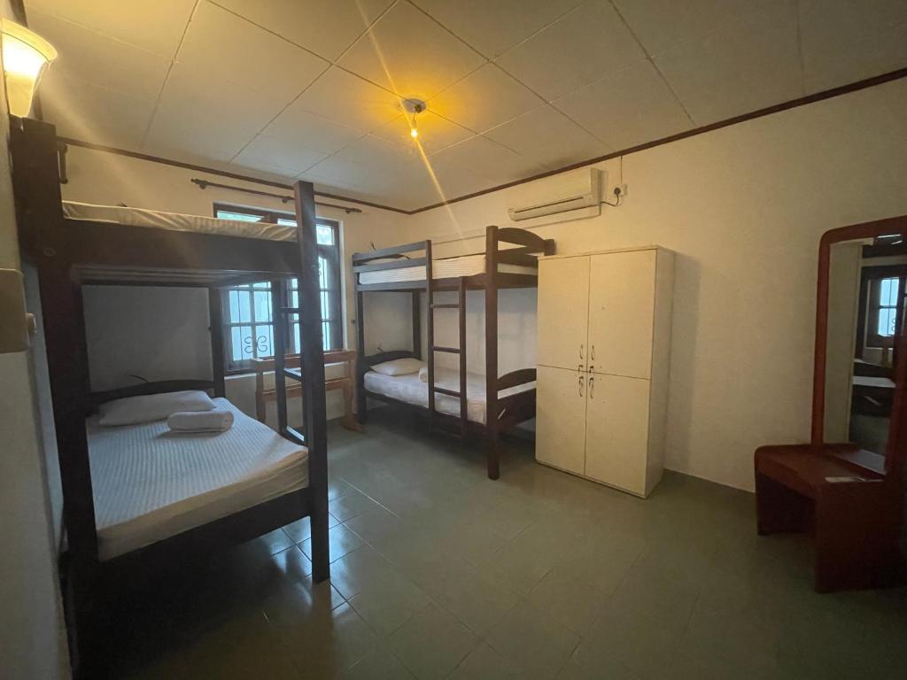 Postel nebo postele na pokoji v ubytování Sky Hostel Negombo