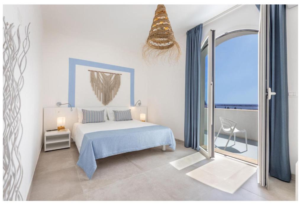 Ένα ή περισσότερα κρεβάτια σε δωμάτιο στο Salento astrea vista mare
