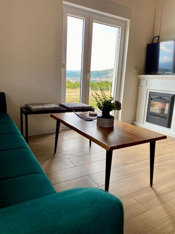 a living room with a couch and a coffee table at Antiva in Livno
