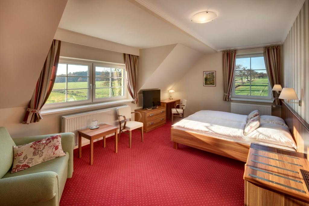 Postel nebo postele na pokoji v ubytování Hotel Kolonie