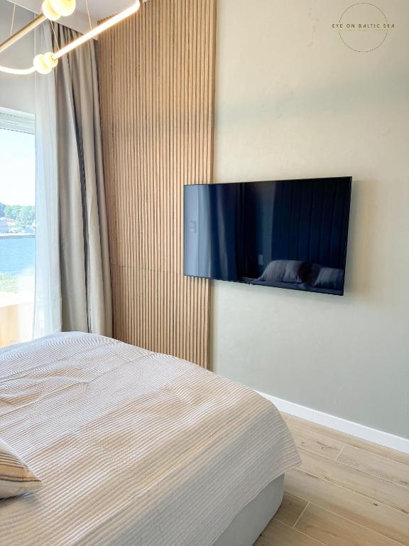 TV/Unterhaltungsangebot in der Unterkunft Brand-New Apartment EYE ON BALTIC SEA Luxurious Spa Escape in Dziwnów with Stunning Views