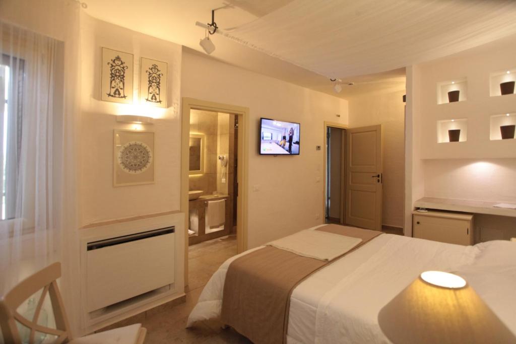 Postel nebo postele na pokoji v ubytování Relais in Contrada