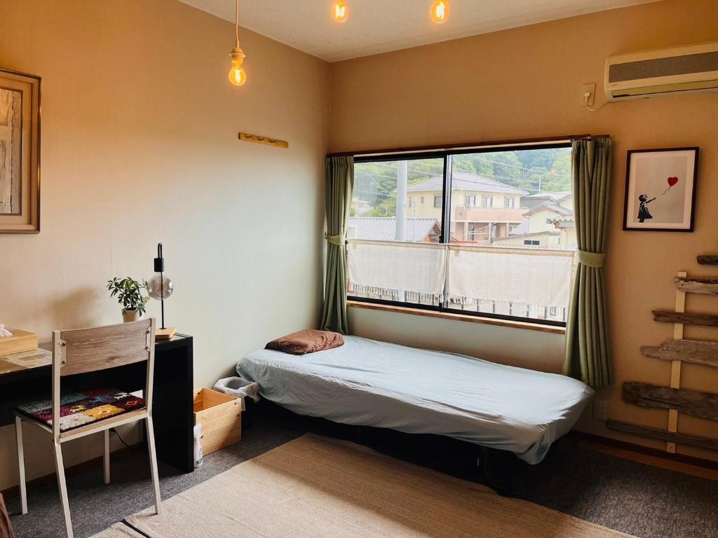 Postel nebo postele na pokoji v ubytování 民宿たかはま Takahama Guest house