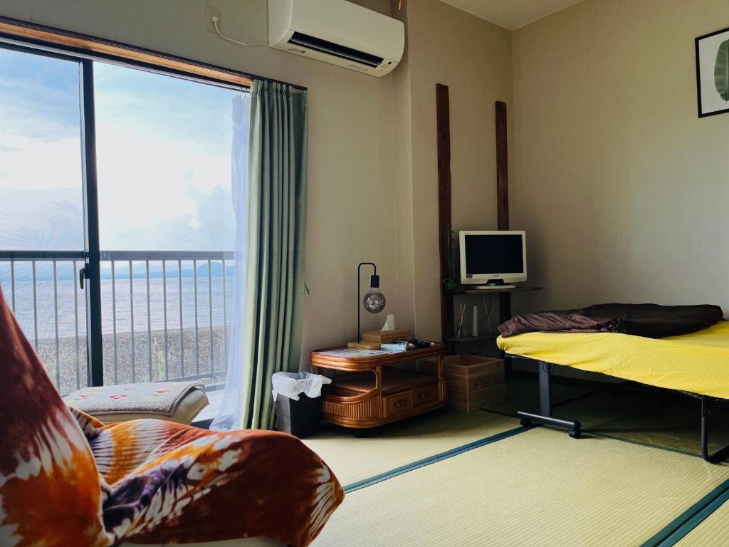 TV a/nebo společenská místnost v ubytování 民宿たかはま Takahama Guest house