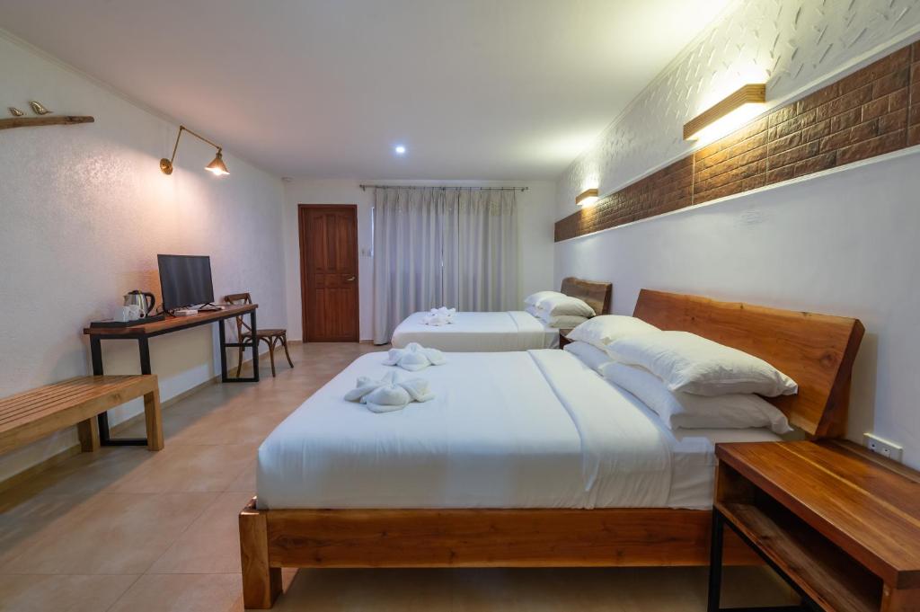 Postel nebo postele na pokoji v ubytování Alona Garden Suites
