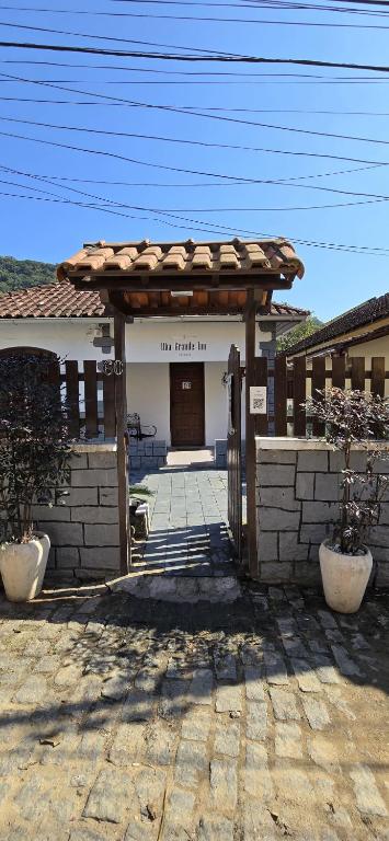 a entrance to a building with a wooden at Ilha Grande Inn in Abraão