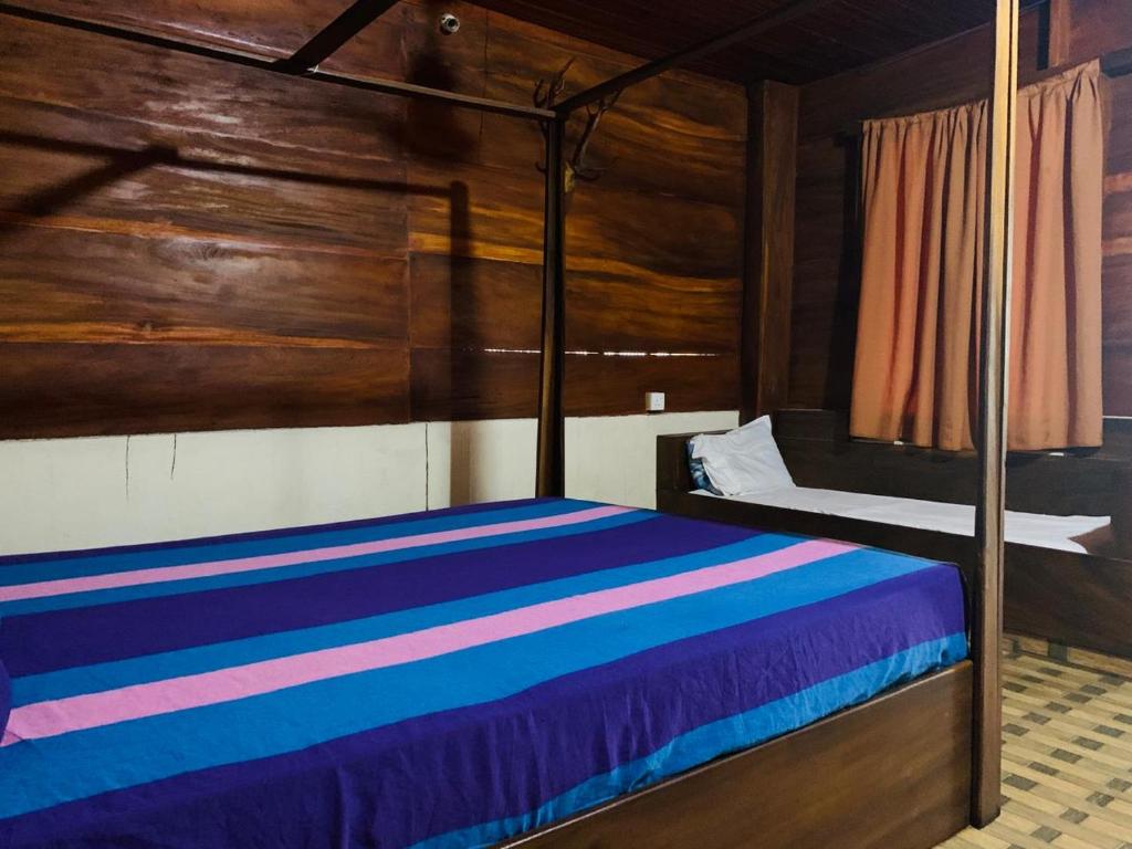 Postel nebo postele na pokoji v ubytování Shim Beach Resort