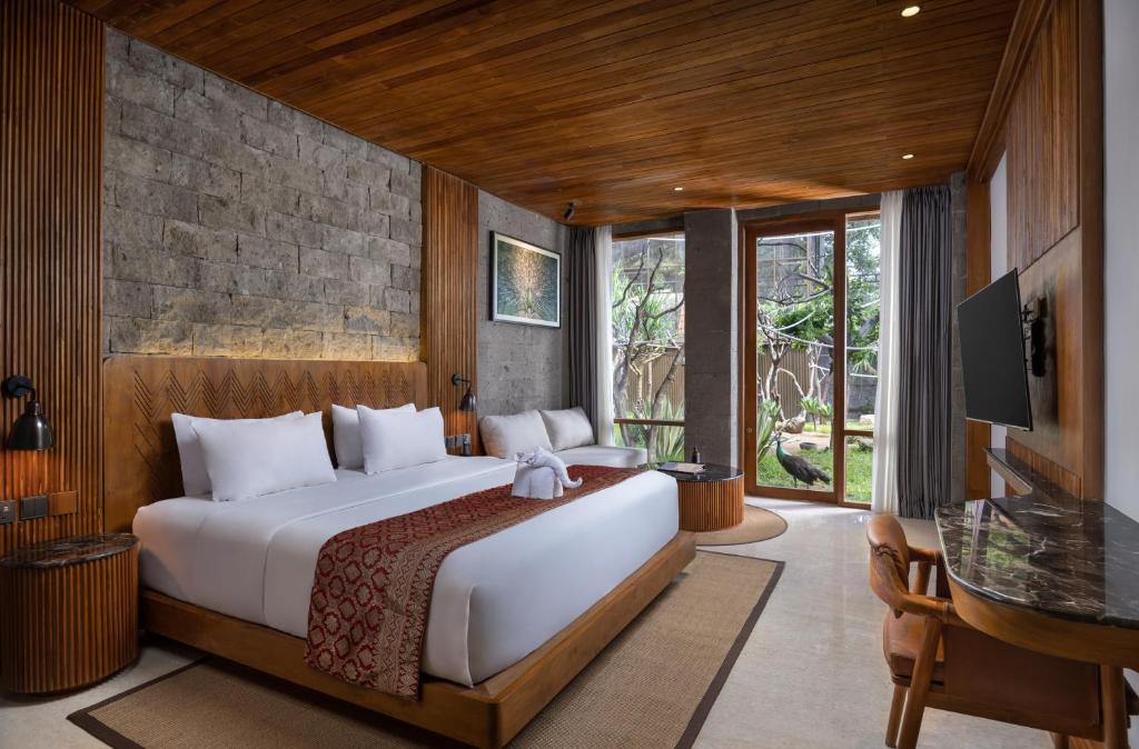 Postel nebo postele na pokoji v ubytování Sanctoo Suites & Villas
