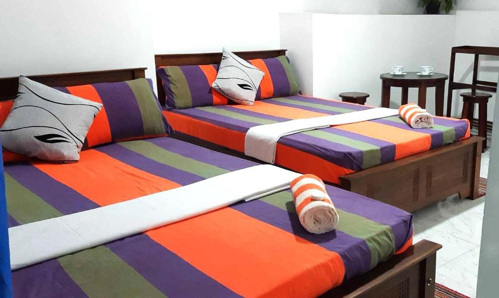 Postel nebo postele na pokoji v ubytování Lilly Rooms
