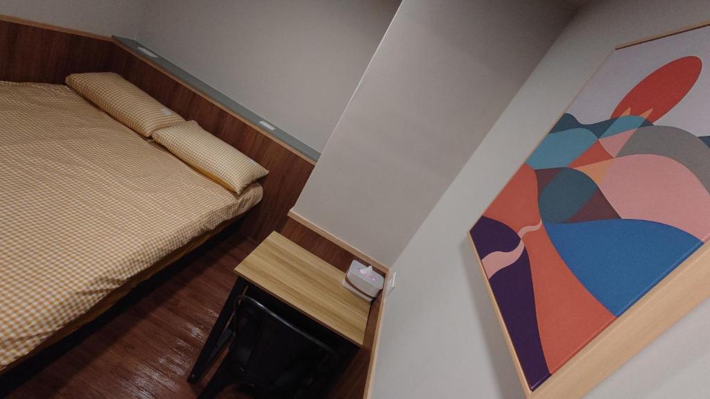 Postel nebo postele na pokoji v ubytování Formosa 101
