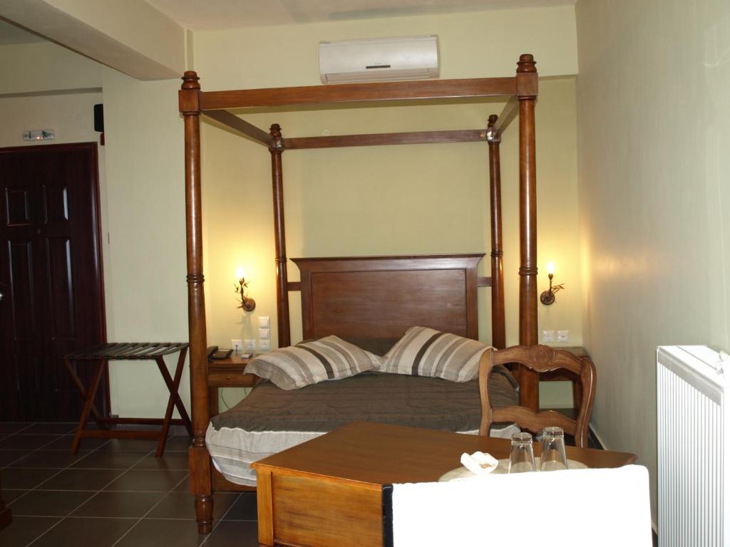 Postel nebo postele na pokoji v ubytování Porto Mani Suites
