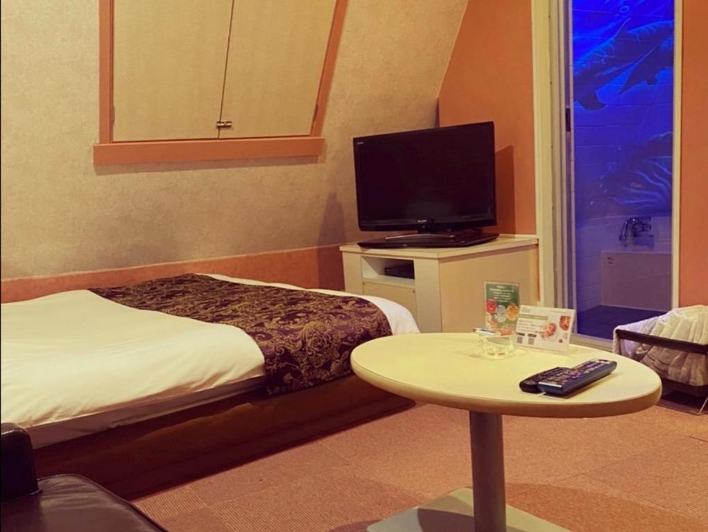 TV a/nebo společenská místnost v ubytování HOTEL WILL渋谷 LOVE HOTEL -Adult only-