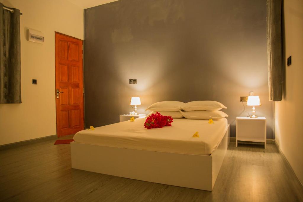 Postel nebo postele na pokoji v ubytování Velidhoo Inn