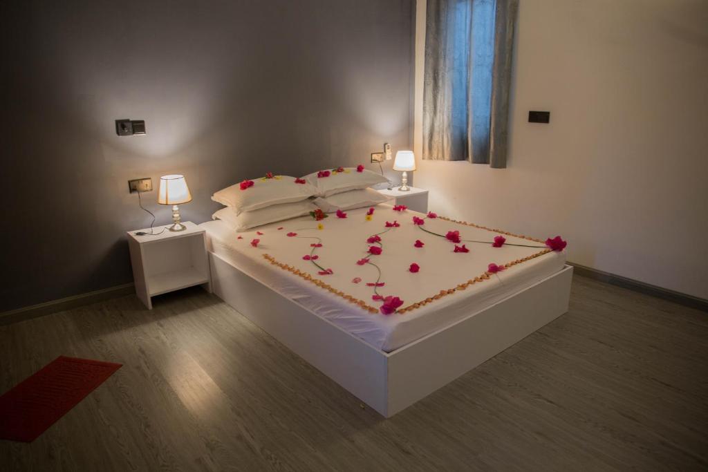 Postel nebo postele na pokoji v ubytování Velidhoo Inn
