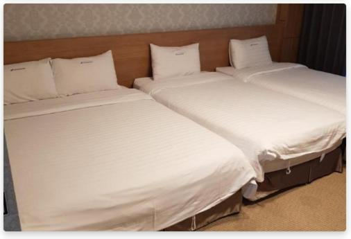 Postel nebo postele na pokoji v ubytování YangYang International Airport Hotel