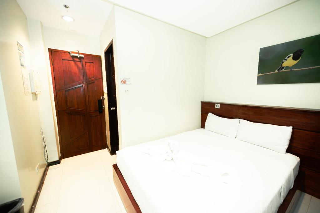 Postel nebo postele na pokoji v ubytování Marianne Hotel