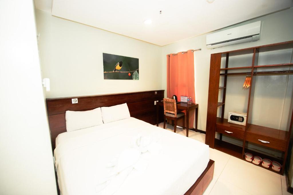 Postel nebo postele na pokoji v ubytování Marianne Hotel