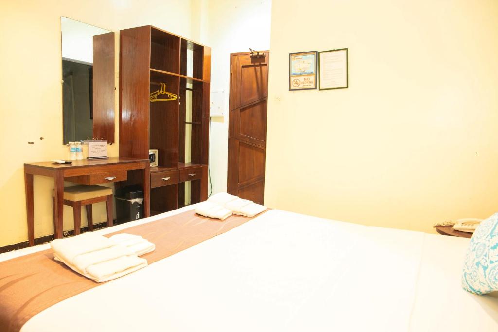 Postel nebo postele na pokoji v ubytování Marianne Hotel