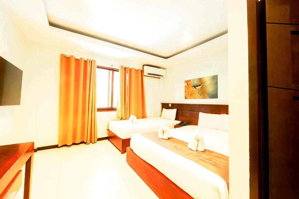 Postel nebo postele na pokoji v ubytování Marianne Hotel