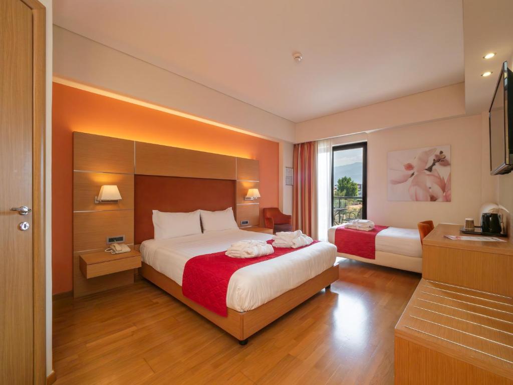 Postel nebo postele na pokoji v ubytování Elektra Hotel & Spa