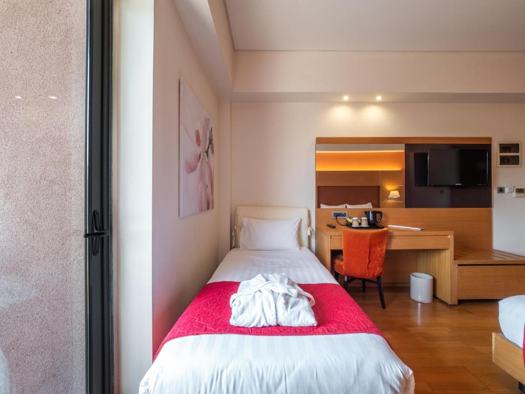 Postel nebo postele na pokoji v ubytování Elektra Hotel & Spa