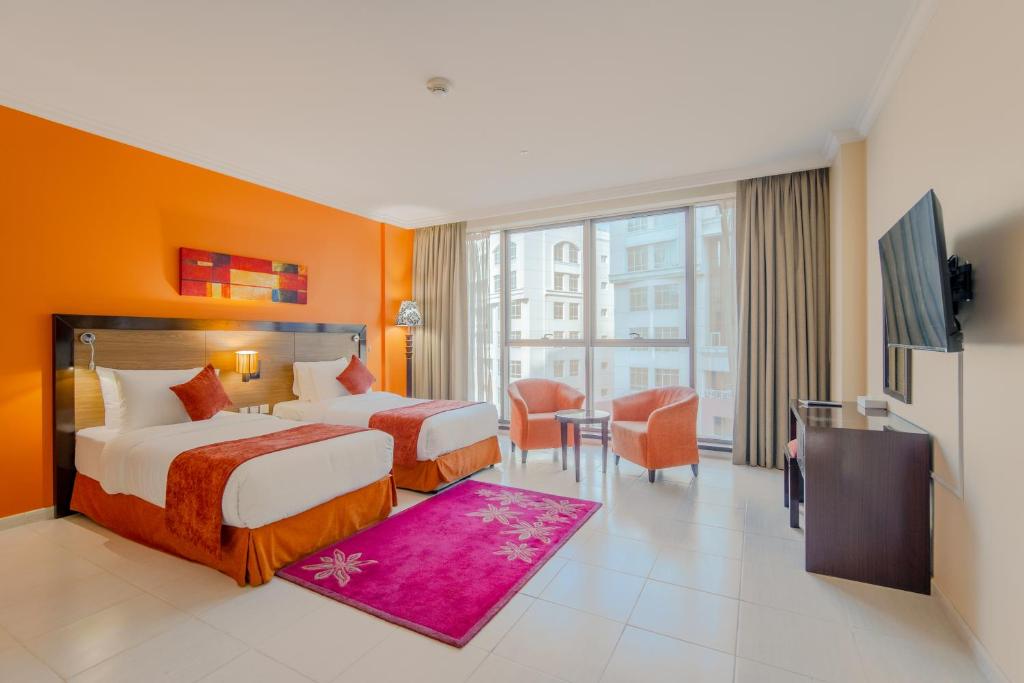 Postel nebo postele na pokoji v ubytování Icon Delux Hotel Apartments Al Barsha - Formerly Abidos