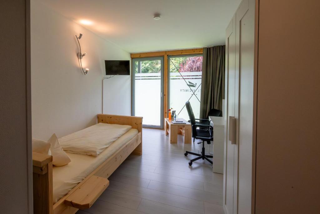 Postel nebo postele na pokoji v ubytování Hotel Vicinity