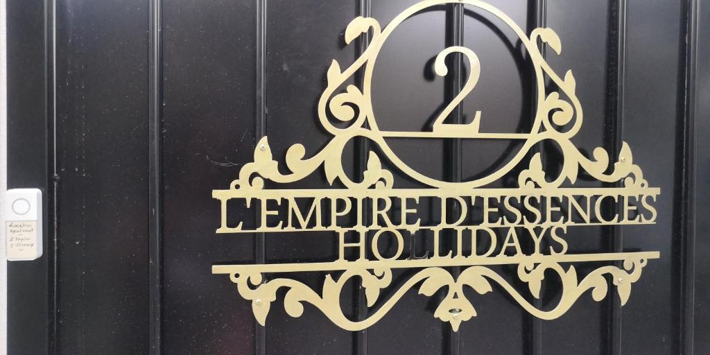 a sign on a door with a number two remembered pleasures holidays at L'Empire D'Essences Appartement in Valréas