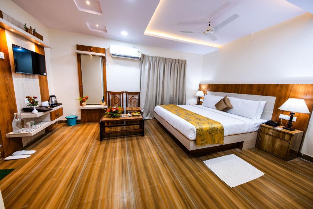 Postel nebo postele na pokoji v ubytování Swosti Palm Resort Gopalpur