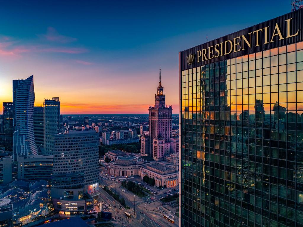 a view of a city skyline at sunset at Warsaw Presidential Hotel in Warsaw