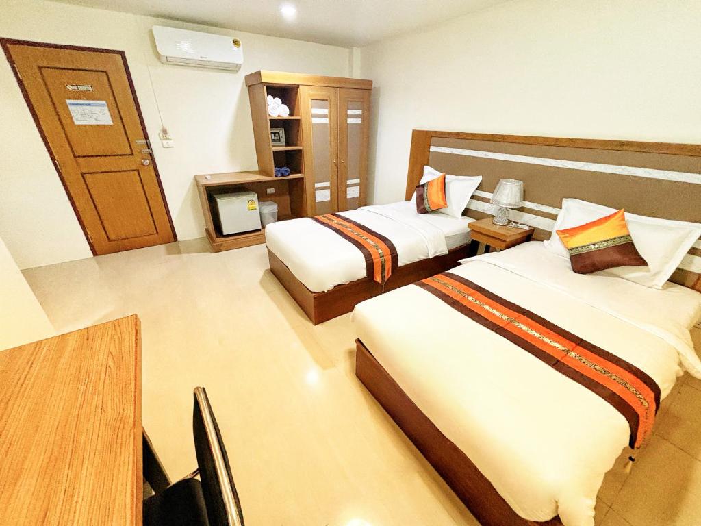 Postel nebo postele na pokoji v ubytování patong v hotel