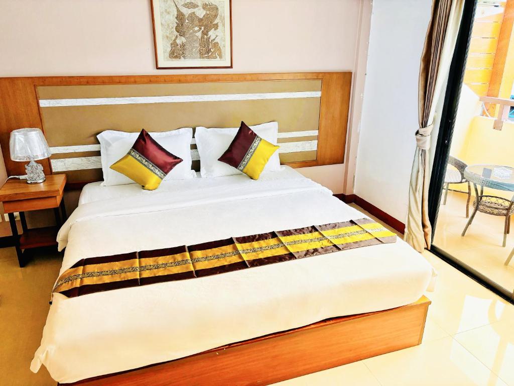 Postel nebo postele na pokoji v ubytování patong v hotel