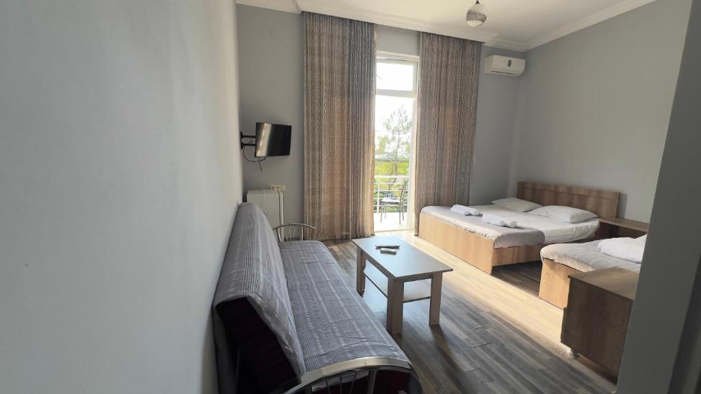 Postel nebo postele na pokoji v ubytování Grand Hotel Kobuleti
