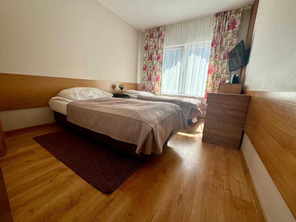 Postel nebo postele na pokoji v ubytování FOREST Family Resort Ustka